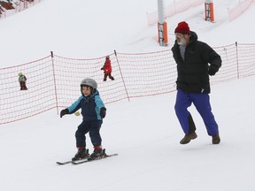 Aldo Santone helps his son, Duncan, 4, learn to ski at Adanac Ski Hill in Sudbury, Ont. on Friday March 20, 2015. John Lappa/Sudbury Star/QMI Agency