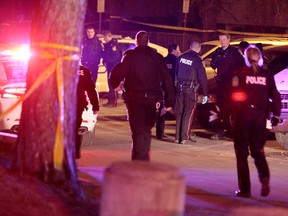 Police outside a Mississauga apartment complex where two officers were seriously injured in a violent confrontation Friday night. (JOHN HANLEY/Special to the Toronto Sun)