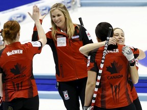 Canada's Dawn McEwen, Jennifer Jones, Jill Officer and Kaitlyn Lawes (L-R) celebrate after they beat Russia in their semi-final curling match at the World Women's Curling Championships in Sapporo March 21, 2015.  REUTERS/Thomas Peter