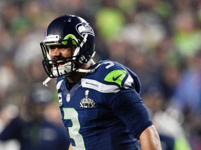 Seattle Seahawks quarterback Russell Wilson (3) reacts after a touchdown against the New England Patriots in the third quarter in Super Bowl XLIX at University of Phoenix Stadium. (Kyle Terada-USA TODAY Sports)