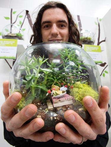 Eric Gibson from Axis Mundi Artistry displays a terrarium during the Edmonton Home and Garden Show at the Edmonton Expo Centre, in Edmonton Alta., on Saturday March 21, 2015. The Show continues Sunday. David Bloom/Edmonton Sun/QMI Agency
