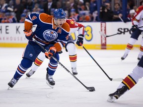 Edmonton forward Taylor Hall (4) carries the puck against Florida during the first period of a NHL hockey game between the Edmonton Oilers and the Florida Panthers at Rexall Place in Edmonton, Alta., on Sunday, Jan. 11, 2015. Ian Kucerak/Edmonton Sun/ QMI Agency
