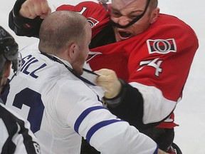 Ottawa Senators' Mark Borowiecki fights Toronto Maple Leaf's Zach Sill during third period action at the Canadian Tire Centre in Ottawa Saturday, March 21, 2015. (Tony Caldwell/Ottawa Sun/QMI Agency)