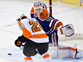 Edmonton's goalie Ben Scrivens (30) stops Philadelphia's Claude Giroux (28) during the second period of the Edmonton Oilers' NHL hockey game against the Philadelphia Flyers at Rexall Place in Edmonton, Alta., on Saturday, March 21, 2015. Codie McLachlan/Edmonton Sun/QMI Agency