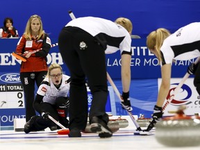 Switzerland's skip Alina Paetz (3rd R) calls out to her sweepers Marisa Winkelhausen (2nd R) and Nicole Schaegli (R) as Canada's skip Jennifer Jones (2nd L) watches during their final curling match at the World Women's Curling Championships in Sapporo March 22, 2015. Pictured at L is Team Canada coach Wendy Morgan. REUTERS/Thomas Peter