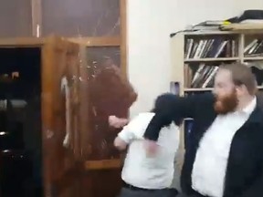 A gang attacks a synagogue in Stamford Hill in north London in the early hours of Sunday morning. (YouTube screengrab)