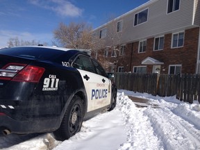 An Edmonton Police Service cruiser is parked outside a Briarwynd Court town home near 81 Ave. and 175 St. Sunday morning after police were called to the area for a suspicious death. DAVID BLOOM/Edmonton Sun