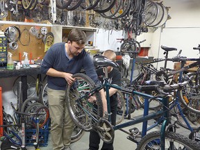 Travis Liewicki and a Marymound school student repair a bicycle that will be shipped to Sierra Leone to assist doctors caring for patients effected by the Ebola virus in this undated handout.