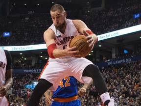 Raptors’ Jonas Valanciunas grabs a rebound against the Knicks at the ACC on Sunday. Craig Robertson/Toronto Sun)