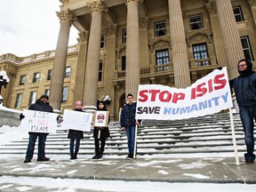 Demonstrators are seen Sunday at the Alberta Legislature Building during a protest against ISIS and foreign involvement in the Middle East. (Codie McLachlan/Edmonton Sun/QMI Agency)
