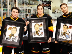 From left, Bulls OA players Brett Gustavsen, Brett Welychka and Adam Bignell are recognized prior to Saturday's OHL game at Yardmen Arena. (Aaron Bell/OHL Images)