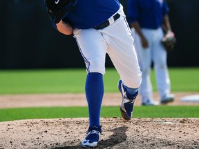 Brett Cecil — who has yet to appear in a spring-training game this year because of a sore shoulder — gets in a workout recently in Dunedin. (STAN BEHAL/TORONTO SUN)