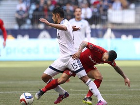 Toronto FC’s Sebastian Giovinco, here trying to steal the ball from Matías Laba of the Vancouver Whitecaps during a game earlier this month, will be sticking around for the Reds’ next game after being left off the Italian team for a EURO 2016 qualifier.