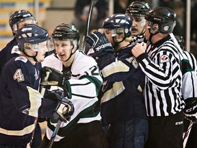 The Spruce Grove Saints and Sherwood Park Crusaders mix it up in Game 6 of their AJHL playoff series at Sherwood Park Arena on March 22, 2015. Photo by Codie McLachlan/Edmonton Sun