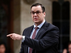 Canada's Industry Minister James Moore speaks during Question Period in the House of Commons on Parliament Hill in Ottawa on Nov. 26, 2014. (REUTERS/Chris Wattie)