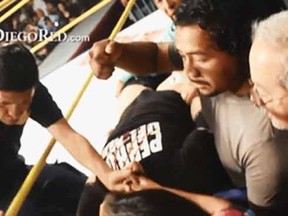 A YouTube screen grab shows emergency personnel working on Perro Aguayo Jr. ringside. (SanDiegoRed.com)