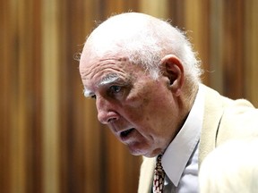 Former Grand Slam doubles champion Bob Hewitt react ahead of court proceedings at the South Gauteng High Court in Johannesburg in this file photo taken February 10, 2015. (REUTERS/Siphiwe Sibeko/Files)