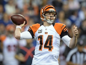 Cincinnati Bengals quarterback Andy Dalton (14) throws a pass against the Indianapolis Colts in the first half in the 2014 AFC Wild Card playoff football game at Lucas Oil Stadium. (Kirby Lee-USA TODAY Sports)
