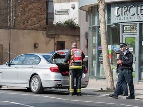 Police near Grange Walk in London's Bermondsey, roughly 400 metres away from a WWII bomb discovered Monday, March 23, 2015. (Peter Maclaine/WENN.com)