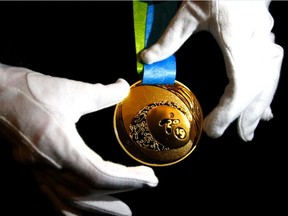 The gold medal for the Toronto 2015 Pan Am and Parapan Am Games is unveiled at the Royal Ontario Museum on March 3, 2015. (Michael Peake/Toronto Sun)