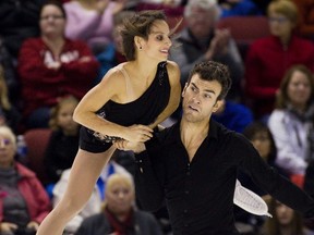 Canada's Meagan Duhamel and Eric Radford perform during the pairs free skating program at the 2014 Skate Canada International in Kelowna, B.C. November 1, 2014. (REUTERS/Ben Nelms)