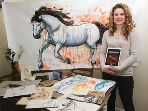 Local graphic artist, Melodie Papp, shows off just a few of the more than 300 pieces of art she created during her year-long self assigned creative project, Horses for a Year. (Julia McKay/The Whig-Standard)