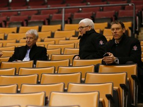 Hockey Canada braintrust, including Bob Nicholson (middle) and Sean Burke (right), watch Canada's world junior team practise on January 1, 2015. (Jack Boland/Toronto Sun/QMI Agenc)