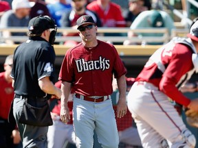 Diamondbacks manager Chip Hale (centre), along with three other members of the team, were ejected during a spring training game that got heated on Monday, March 23, 2015. (Christian Petersen/Getty Images/AFP)