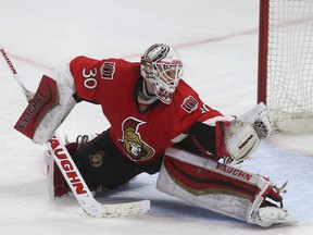 Ottawa Senators goalie Andrew Hammond makes a glove save during third period action against the Toronto Maple Leafs at the Canadian Tire Centre in Ottawa Saturday March 21, 2015. (Tony Caldwell/Ottawa Sun/QMI Agency)