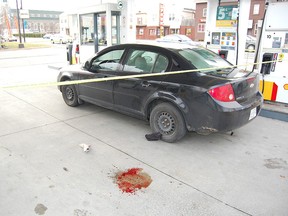 Sudbury Star file photo
The car used in an armed robbery of the Food Basics store on Notre Dame Avenue on Nov. 3, 2012, is shown cordoned off with police tape in this file photo.