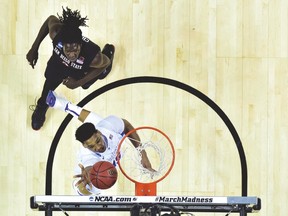 Duke Blue Devils’ Jahlil Okafor gets an easy layup in front of San Diego State Aztecs forward Angelo Chol. (USA TODAY SPORTS)