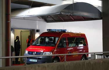 An emergency vehicle stands at an entrance at Duesseldorf airport on March 24, 2015. Lufthansa's budget carrier Germanwings confirmed its flight 4U9525 from Barcelona to Duesseldorf crashed in the French Alps. (REUTERS/Ina Fassbender)