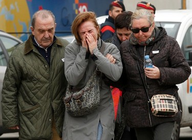 Family members of passengers feared killed in Germanwings plane crash react at Barcelona's El Prat airport on March 24, 2015. (REUTERS/Gustau Nacarino)