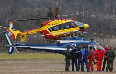 Rescue helicopters from the French Securite Civile and the Gendarmerie are seen during a rescue operation near the crash site of an Airbus A320, near Seyne-les-Alpes, in the French Alps, March 24, 2015. (REUTERS/Jean-Paul Pelissier)