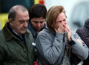 Family members of passengers feared killed in Germanwings plane crash react at Barcelona's El Prat airport on March 24, 2015. (REUTERS/Albert Gea)