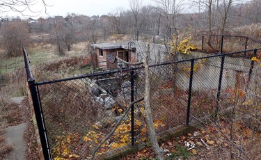 Author and historian Lynn Philip Hodgson and Marlene Hodgson at the remains  of Camp 30, a German WWII prisoner of war camp in Bowmanville, ON that has become neglected over the years  - this was the water plant on Sunday November 9, 2014. Michael Peake/Toronto Sun/QMI Agency