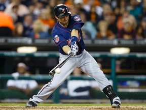 Minnesota Twins second baseman Brian Dozier hits an RBI single. (Rick Osentoski/USA TODAY Sports)