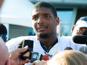 Michael Sam (96) addresses the press after practice at Rams Park in St. Louis, Missouri in this July 29, 2014 file photo. (REUTERS)