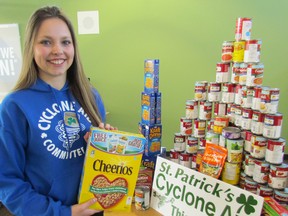 Kendra Hoek, student co-chairperson of St. Patrick's High School's Cyclone Aid food drive, holds a box of cereal during a press conference on Tuesday March 24, 2015 at the school in Sarnia, Ont., to announce students will be out in Sarnia and Point Edward Saturday morning collecting non-perishable food for the Inn of the Good Shepherd.  Paul Morden/Sarnia Observer/QMI Agency