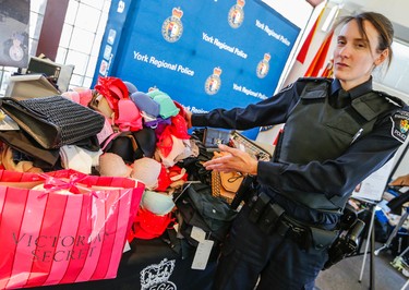 York Regional Police show over a million dollars in clothing that was shoplifted from major brand stores in the Toronto and York Region area. Five people were arrested. Pc. Laura Nicolle shows some of $250,000. in Victoria Secret bras on Tuesday March 24, 2015. Dave Thomas/Toronto Sun/QMI Agency