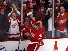 Detroit Red Wings' Darren Helm and fans celebrate his goal against the San Jose Sharks at St. Louis Arena on May 6, 2011. (REUTERS/Rebecca Cook)