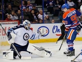 Ondrej Pavelec makes a glove save in front of Edmonton Oilers forward Ryan Nugent-Hopkins (93) during the third period at Rexall Place on Monday night. Pavelec will be rested on Tuesday night in Vancouver, with Michael Hutchinson getting the start in net. (Perry Nelson-USA TODAY Sports)