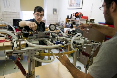 Undergraduate seniors in Prof. Marko Popovic's lab describe their quadruped robot "Hydro Dog" at Worcester Polytechnic Institute in Worcester, Mass., March 20, 2015. REUTERS/Dominick Reuter