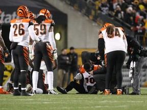 Bengals wide receiver A.J. Green (18) lays on the field after suffering an apparent injury against the Steelers during NFL action in Pittsburgh on Dec. 28, 2014. (Jason Bridge/USA TODAY Sports)
