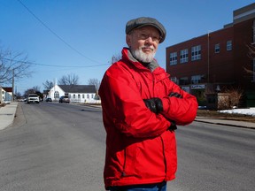 Ken Cuthbertson in front of the old Robert Meek school now home to the Boys & Girls Club of Greater Kingston on Tuesday March 24 2015.. Cuthbertson grew up in the Inner Harbour neighbourhood and was at Robert Meek school from 1956 until 1962. (Annie Sakkab)-KINGSTON WHIG-STANDARD/QMI AGENCY