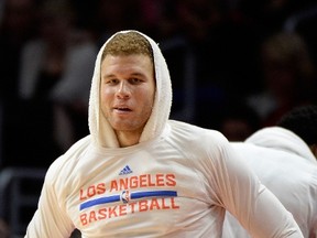 Blake Griffin of the Los Angeles Clippers reacts to his teams play from the bench during a 123-84 win over the Brooklyn Nets at Staples Center on January 22, 2015. (Harry How/Getty Images/AFP)
