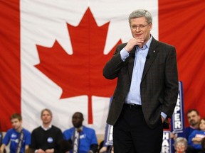 Conservative leader and Canada's Prime Minister Stephen Harper pauses during a campaign rally in Beaumont, Alberta March 28, 2011. Canadians will head to the polls in a federal election May 2.      REUTERS/Chris Wattie