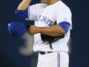 Ricky Romero is back in camp this spring hoping to have an 
Edwin Encarnacion kind of revival. (Stan Behal/Toronto Sun)