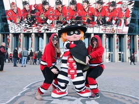 A fans poses with the Hamburgler prior to an NHL game between the Ottawa Senators and the Boston Bruins at Canadian Tire Centre on March 19, 2015 in Ottawa, Ontario, Canada.   Jana Chytilova/Freestyle Photography/Getty Images/AFP