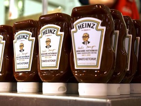 Commemorative ketchup bottles with portaits of Warren Buffett are seen at the exhibition of Berkshire Hathaway companies at the annual meeting in Omaha, Nebraska in this May 3, 2014 file photo. REUTERS/Rick Wilking/Files